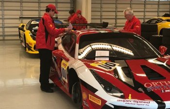 Ferrari cars and mechanics in the SuperSpeed Motorsports garage